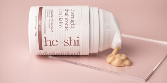 Image of He-Shi Overnight Hyaluronic Tan Balm on its side with product spilling out onto a glass plinth.