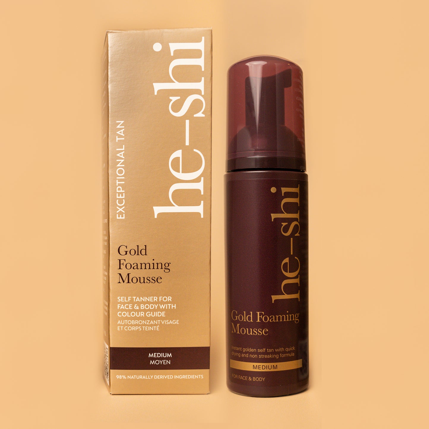 Image of He-Shi Gold Foaming Mousse bottle and outer box on a pale gold background.