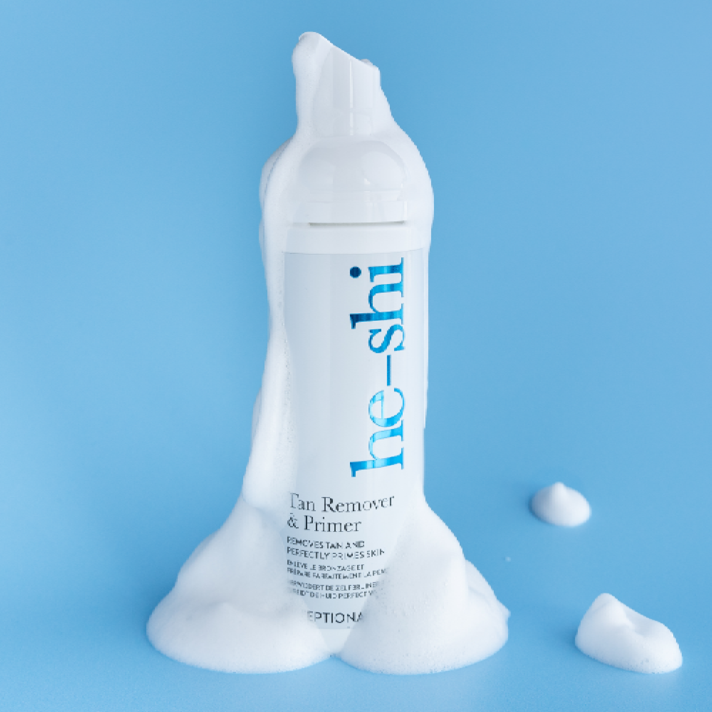 Image of He-Shi Tan Remover & Primer on blue background with the white foam product dripping down the bottle.