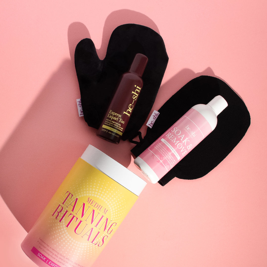 Image showing He-Shi Tanning Rituals Gift Set laid on a pink background with the products spilling out.