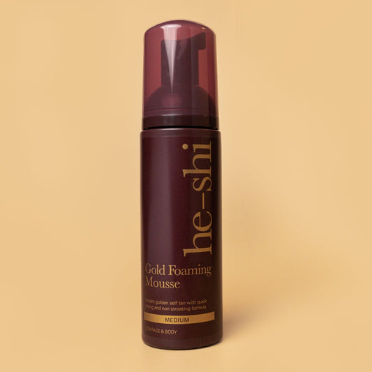 He-Shi Gold Foaming Mousse bottle shown on a cream background