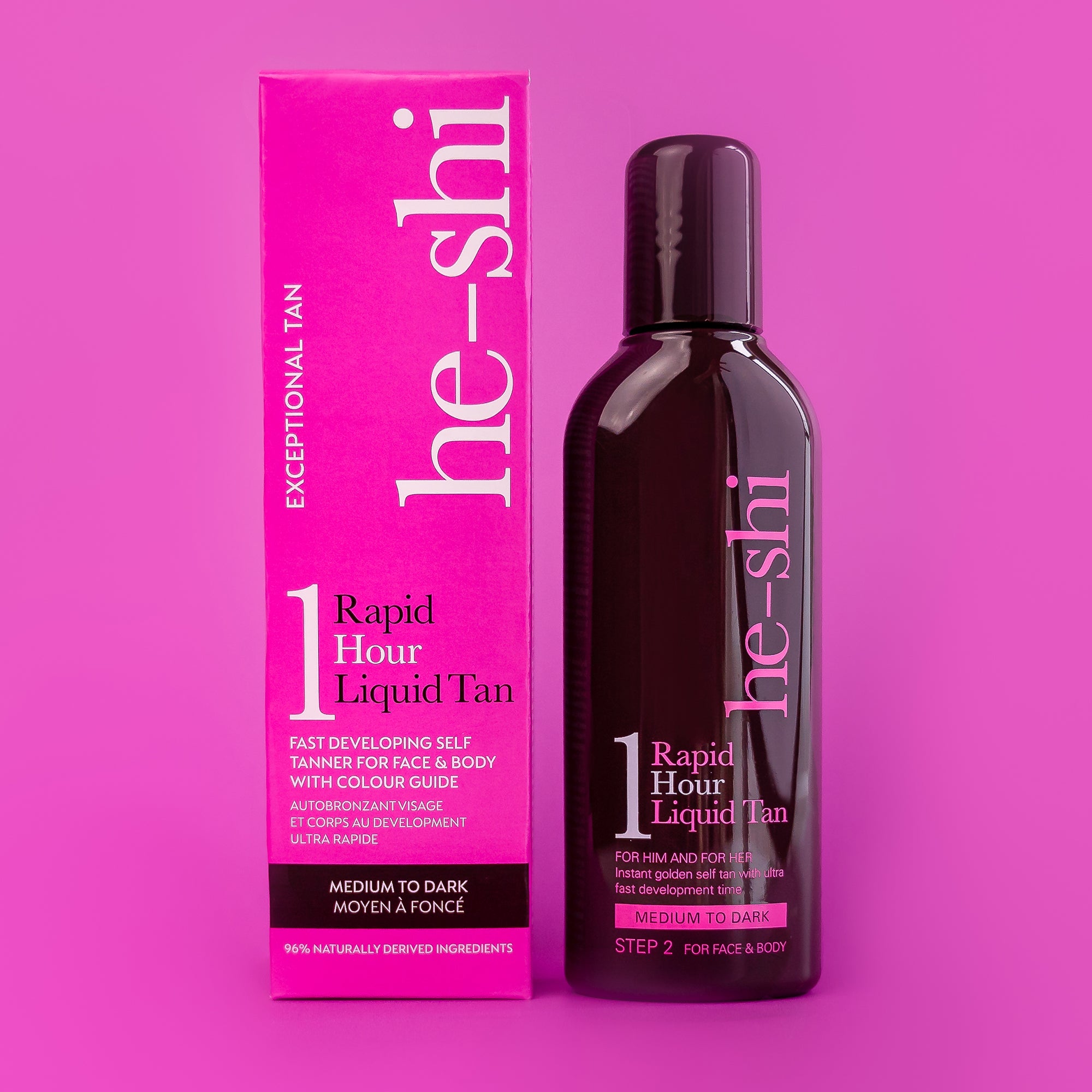 Bottle of He-Shi Rapid 1 Hour Liquid Tan bottle and outer box on a pink background