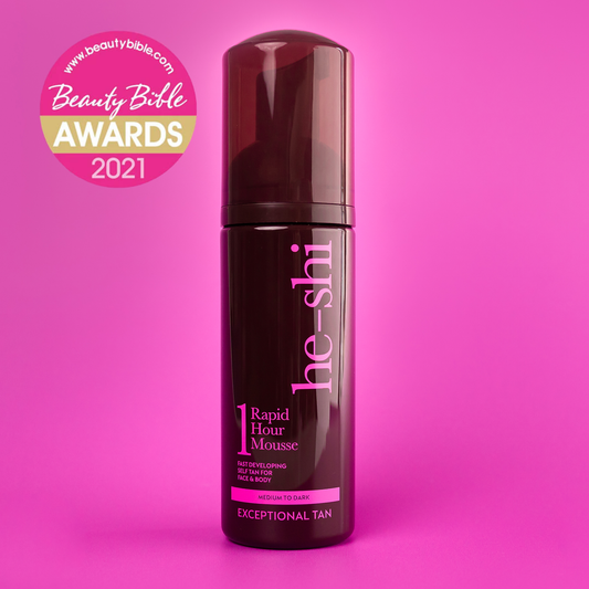He-Shi Rapid 1 Hour Tanning Mousse bottle on pink background featuring a Beauty Bible Awards 2021 Logo