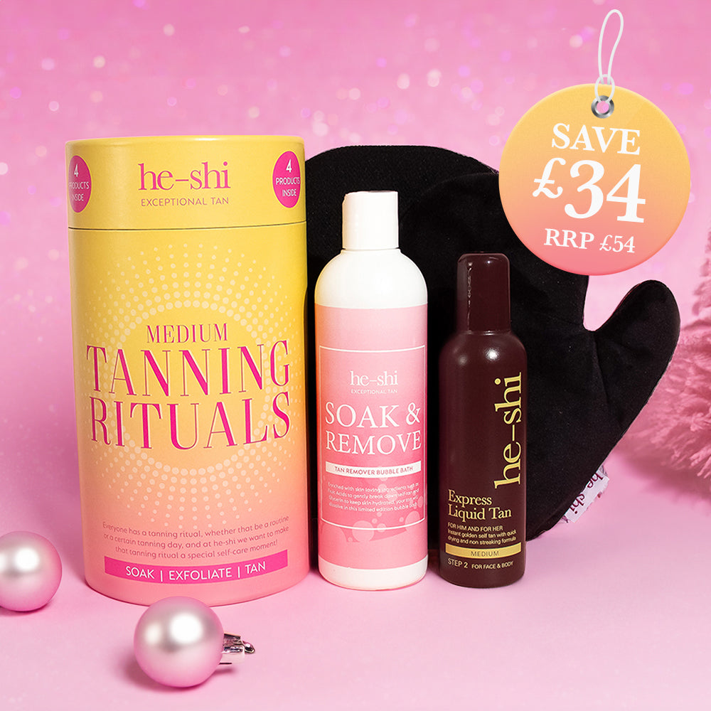 Image showing He-Shi Tanning Rituals Gift Set on a pink background and the products contained beside it