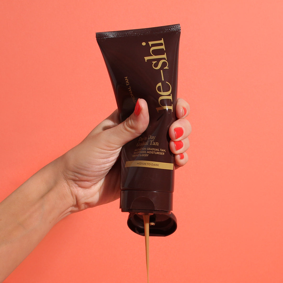 image of He-Shi Dark Day to Day Gradual Tan tube being squeezed
