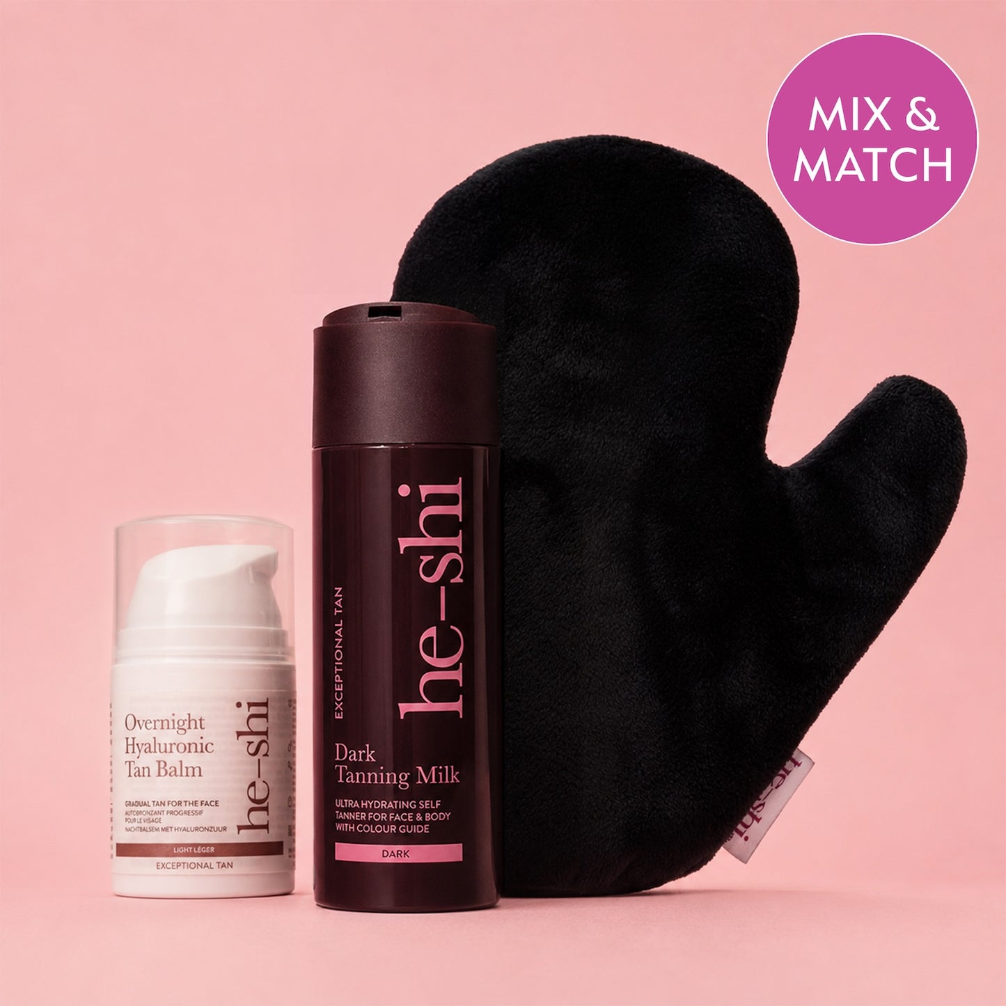 Three He-Shi products arranged on a pink background: a white Overnight Hyaluronic Tan Balm bottle, a dark brown Dark Tanning Milk bottle, and a black velvet mitt. A pink circular badge in the top right says 'MIX & MATCH'.