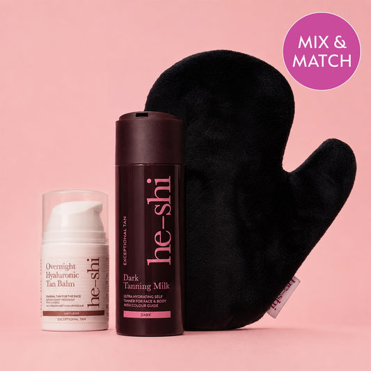 Three He-Shi products arranged on a pink background: a white Overnight Hyaluronic Tan Balm bottle, a dark brown Dark Tanning Milk bottle, and a black velvet mitt. A pink circular badge in the top right says 'MIX & MATCH'.