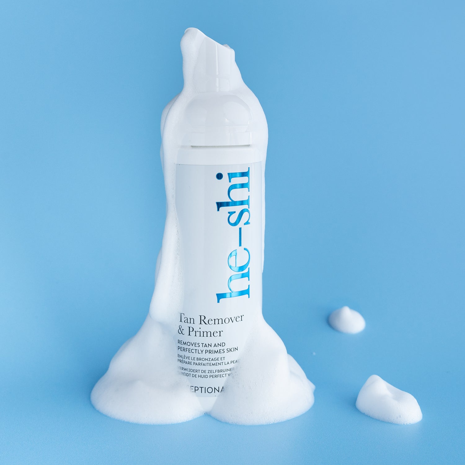 overflowing bottle of He-Shi Tan Remover and Primer