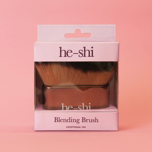 He-shi blending brush in its box on a pink background