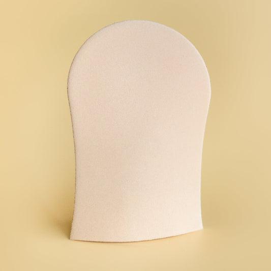 image of he-she tan mitt with sponge fabric on a yellow background